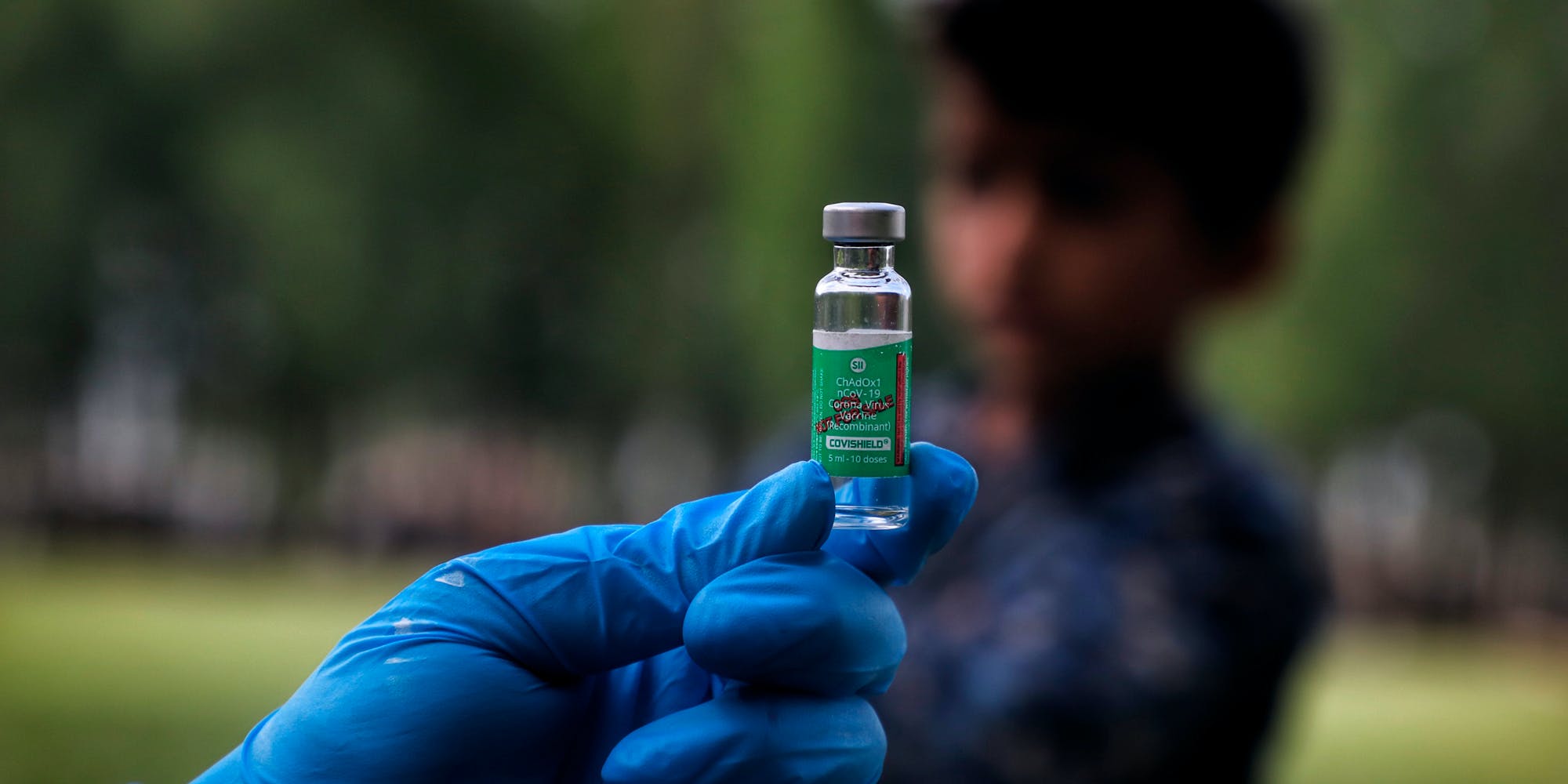 A Health Worker holds a Used Vial of COVISHIELD Coronavirus Vaccine at a Vaccination Center in Sopore, District Baramulla, Jammu and Kashmir, India on 03 May 2021. Serum Institute of India CEO Aadar Poonawalla has said that the production of COVID-19 vaccine Covishield is in full swing in Pune and he will review the operations once he is back in the country. (Photo by Nasir Kachroo/NurPhoto via AP)