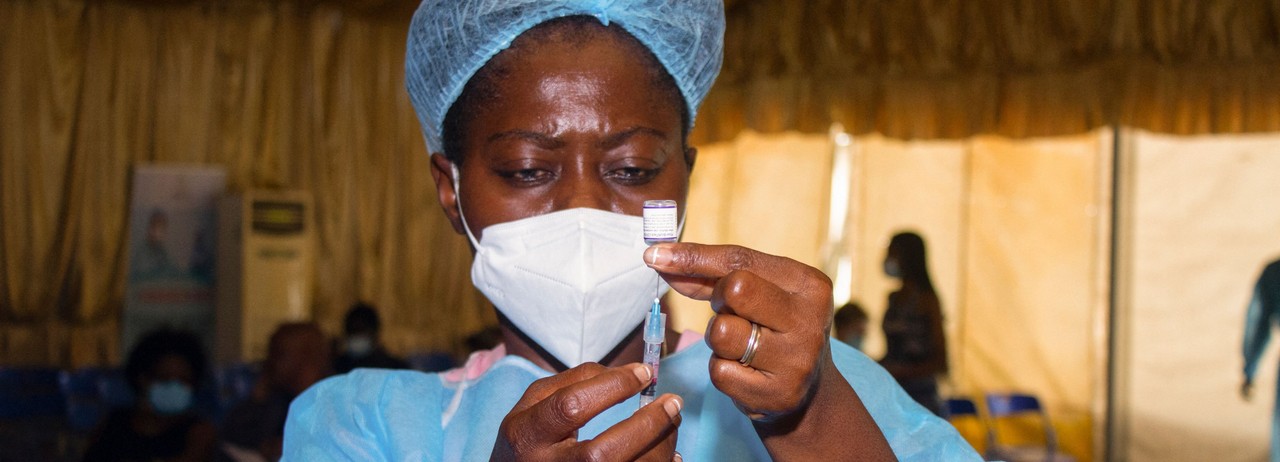 A healthcare worker prepares a coronavirus vaccine dose