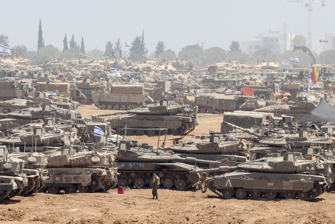 Israeli military gathers at a position near the border fence with the Gaza Strip.