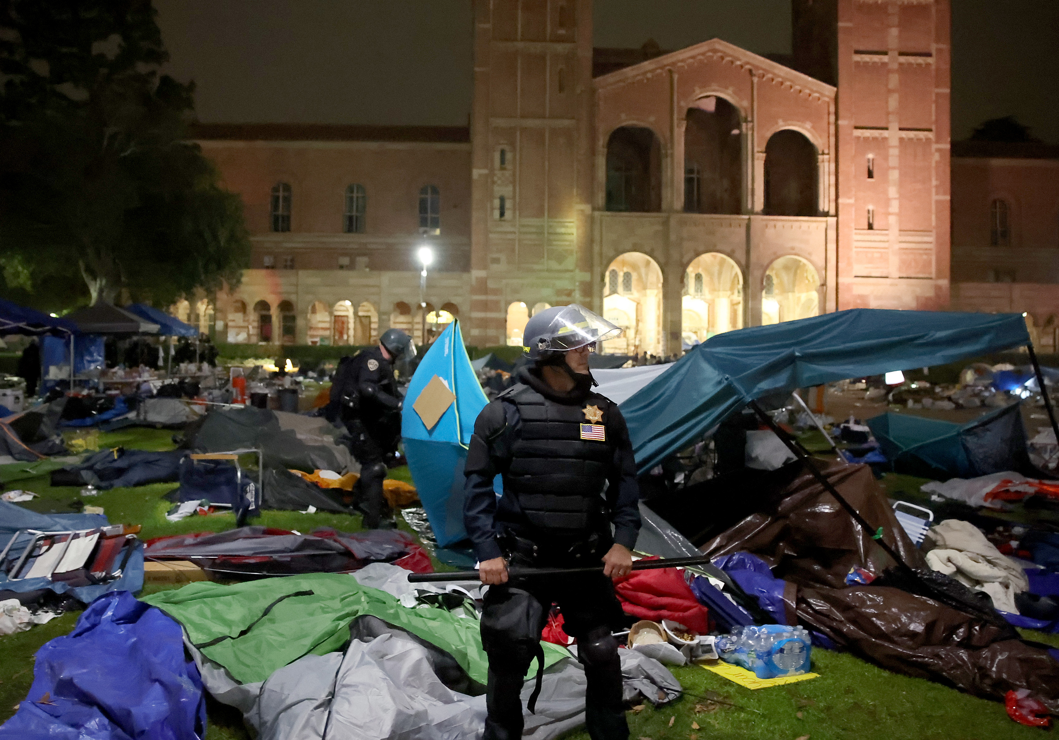 LOS ANGELES CA  MAY 2, 2024 -- Police tear down the tents on the UCLA campus Thursday, May 2, 2024. (Jason Armond / Los Angeles Times via Getty Images)